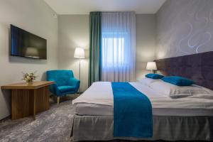 Posteľ alebo postele v izbe v ubytovaní Tulip Hotels - Wroclaw Patio