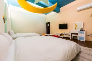 Giường trong phòng chung tại GJia Taitung B&B