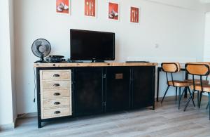 a entertainment center with a television on top of it at Appartement Val Rose II, 11de verdieping in Blankenberge