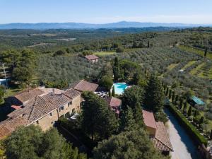 an aerial view of a estate with a swimming pool at Casale Poggio al Vento by VacaVilla in Sinalunga