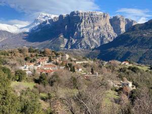 a small village in front of a mountain at Comfortable Apartment in Village Saint Minas in Ágios Minás