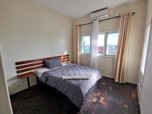 Ένα ή περισσότερα κρεβάτια σε δωμάτιο στο TD Guest House 4 Plus