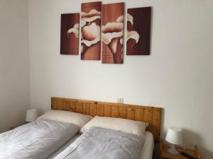 Ένα ή περισσότερα κρεβάτια σε δωμάτιο στο B&B Astor