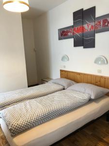 Ένα ή περισσότερα κρεβάτια σε δωμάτιο στο B&B Astor
