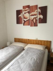 Ένα ή περισσότερα κρεβάτια σε δωμάτιο στο B&B Astor