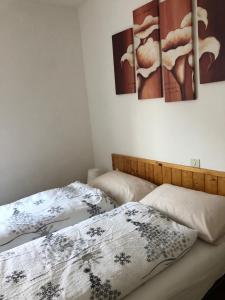 Ένα ή περισσότερα κρεβάτια σε δωμάτιο στο B&B Astor