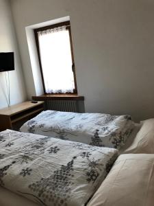 Ένα ή περισσότερα κρεβάτια σε δωμάτιο στο B&B Astor