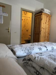 Ένα ή περισσότερα κρεβάτια σε δωμάτιο στο B&B Astor