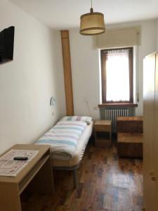 Ένα ή περισσότερα κρεβάτια σε δωμάτιο στο B&B Astor