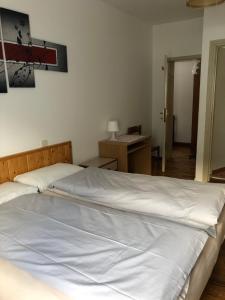 Ένα ή περισσότερα κρεβάτια σε δωμάτιο στο B&B Astor