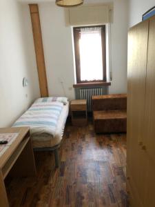 Ένα ή περισσότερα κρεβάτια σε δωμάτιο στο B&B Astor