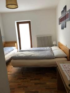 Ένα ή περισσότερα κρεβάτια σε δωμάτιο στο B&B Astor