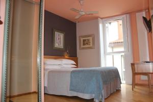 Posteľ alebo postele v izbe v ubytovaní Hotel Zarampallo