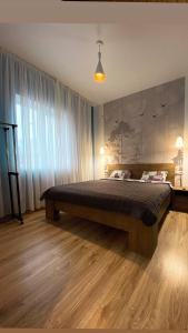 Un pat sau paturi într-o cameră la Бабай Садиба
