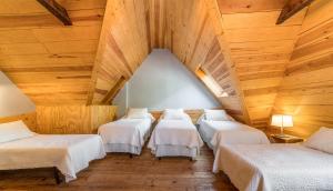 A bed or beds in a room at Casa Rural "Casa Chin", Val d'Aran