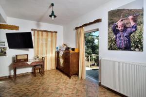 A television and/or entertainment centre at Villa Areti - A Cottage in the Cretan Nature