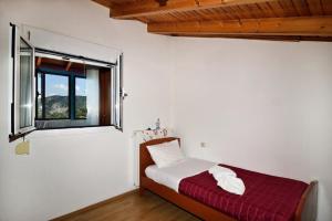 A bed or beds in a room at Villa Areti - A Cottage in the Cretan Nature