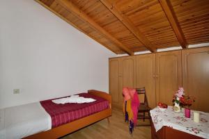 A bed or beds in a room at Villa Areti - A Cottage in the Cretan Nature