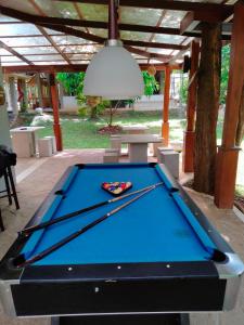a pool table sitting under a pavilion with a ceiling at Nil Diya Mankada Safari Lodge in Udawalawe