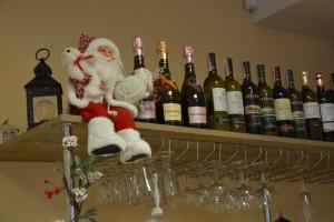 a bunch of wine bottles sitting on a shelf at Karavella in Mykolaiv