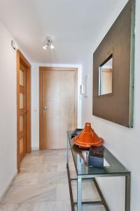 a room with a glass table and a door at Apartamento SAN FERMIN in Benalmádena