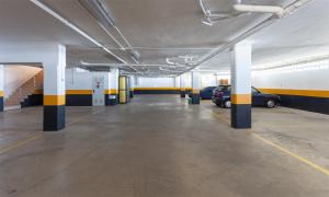 an empty parking garage with cars parked in it at Apartamento SAN FERMIN in Benalmádena