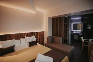 Ein Bett oder Betten in einem Zimmer der Unterkunft La Trobada Hotel Boutique