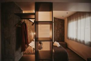 Ein Bett oder Betten in einem Zimmer der Unterkunft La Trobada Hotel Boutique
