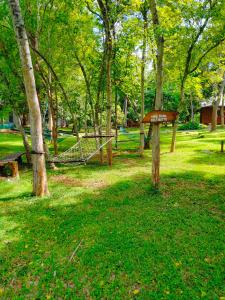 a park with a sign in the grass at Nil Diya Mankada Safari Lodge in Udawalawe