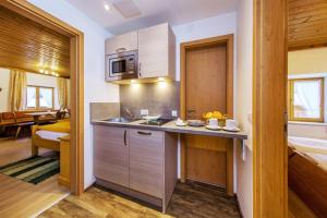 a kitchen with a sink and a counter top at Feichtenhof in Reit im Winkl +23 photos