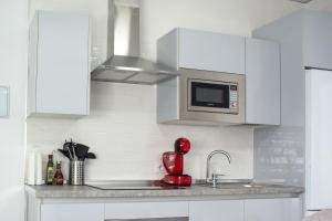 Kuchyň nebo kuchyňský kout v ubytování Apartamento Calma