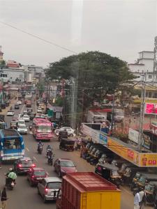 a busy city street filled with lots of traffic at MALABAR Residency in Perintalmanna