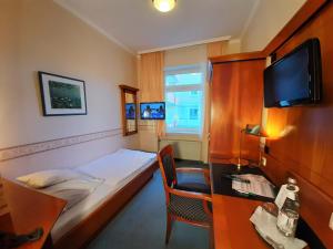 TV a/nebo společenská místnost v ubytování Hotel Krupp