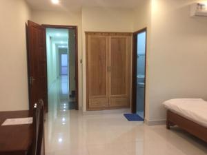 Postel nebo postele na pokoji v ubytování Nhà nghỉ Linh Quân