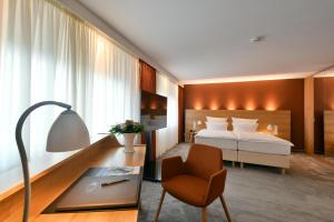 Postel nebo postele na pokoji v ubytování Hotel Adler Asperg