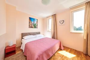 Postel nebo postele na pokoji v ubytování Apartment Vita Moela 23 & 24