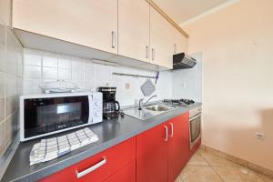 Kuchyň nebo kuchyňský kout v ubytování Apartment Vita Moela 23 & 24