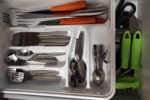 a drawer filled with lots of utensils at Zentrum Speyer Premium-Apartment in Speyer