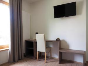 TV a/nebo společenská místnost v ubytování Guesthouse Rungg