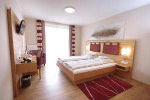 Кровать или кровати в номере Da`Sporrer Hotel & Wirtshaus