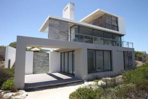 a house on top of a hill at VAME Beachfront in Yzerfontein