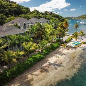 an aerial view of the resort and the beach at South Point Antigua in English Harbour Town