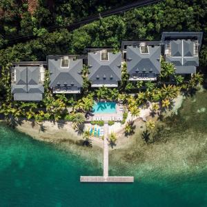 an aerial view of a resort on the water at South Point Antigua Ocean Suites in English Harbour Town