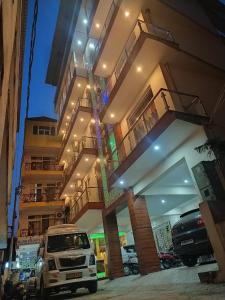 a white van parked in front of a building at Hotel The Shivaay - Delight Inn Rishikesh in Rishīkesh