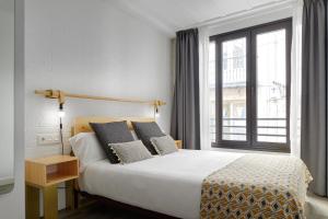 Postel nebo postele na pokoji v ubytování Hostal Arriazu