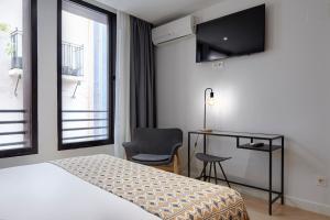 Postel nebo postele na pokoji v ubytování Hostal Arriazu