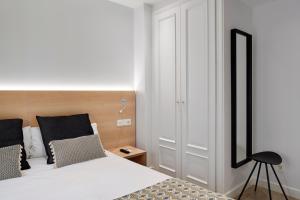 Postel nebo postele na pokoji v ubytování Hostal Arriazu
