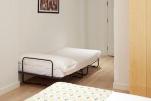 Postel nebo postele na pokoji v ubytování Hostal Arriazu