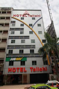 a hotel building with a hoteltaltal sign on it at Tai Ichi Hotel Kuala Lumpur in Kuala Lumpur
