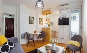 TV in/ali zabaviščno središče v nastanitvi Apartman Mia